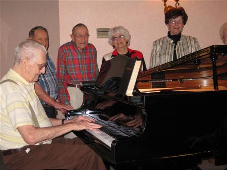 EM Residents Around Piano