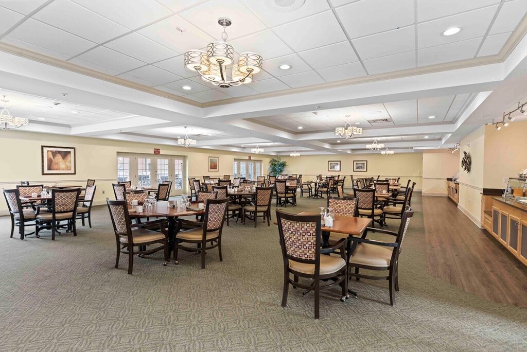 community dining room with chairs and tables at Ephrata Manor