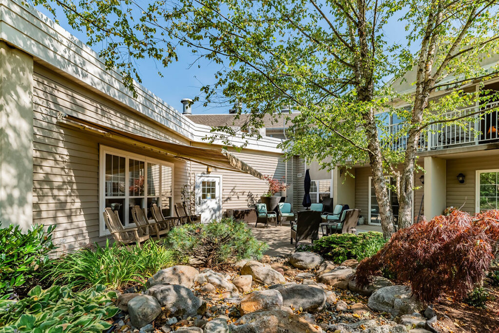 Kindred Place at Annville senior apartments view of outdoor space with green trees, tables