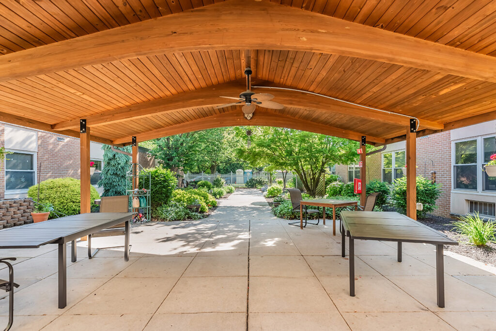 outdoor enclosed courtyard with wood beams, fan at Lebanon Valley Home